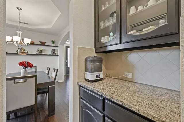 a view of a kitchen with a sink and cabinets