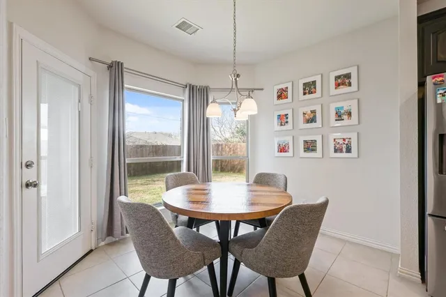 a dining room with furniture and window