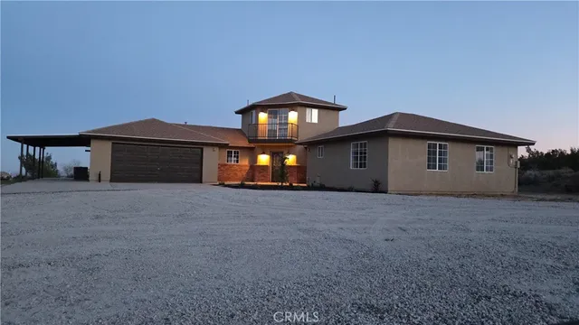 a view of a house with a yard and garage