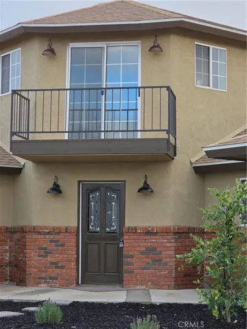 a front view of a house with balcony
