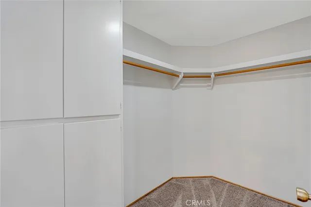 a bathroom with a shower a toilet and a tub