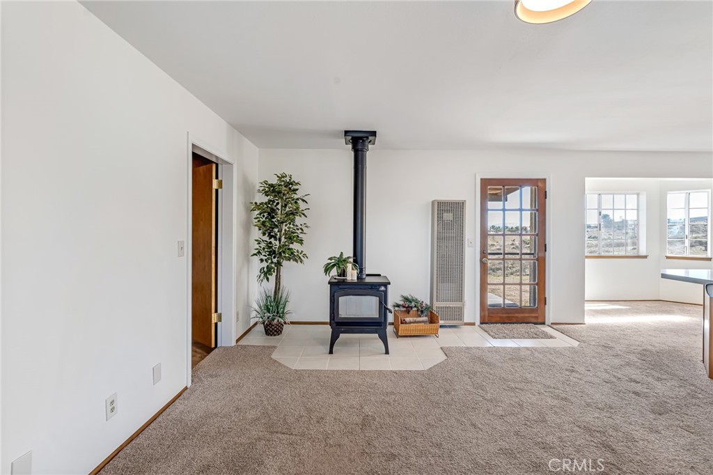 8325 Johnson Road Phelan, CA 92371 - Photo 9 of 53 Family room w/woodburning stove
