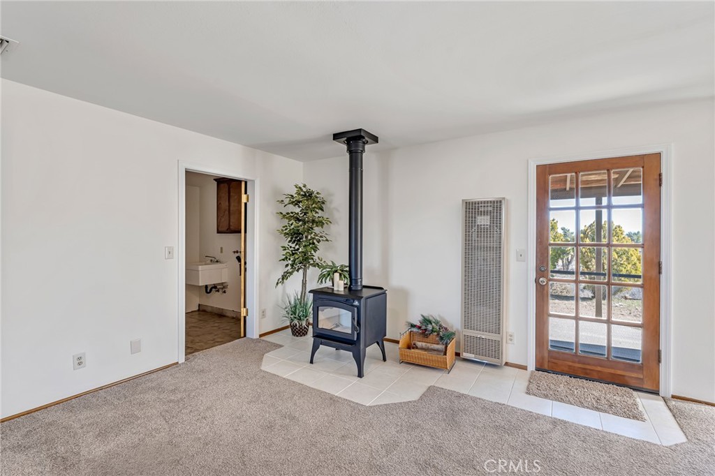 8325 Johnson Road Phelan, CA 92371 - Photo 10 of 53 Family room w/woodburning stove