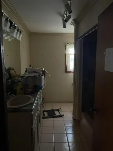 a kitchen with a sink and cabinets