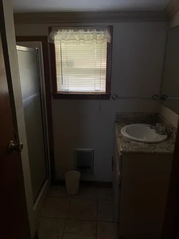 a bathroom with a sink toilet and mirror