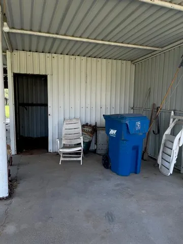 a view of a room with furniture and a window