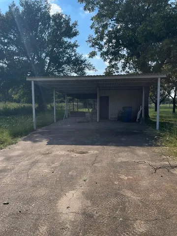 a house with trees in the background