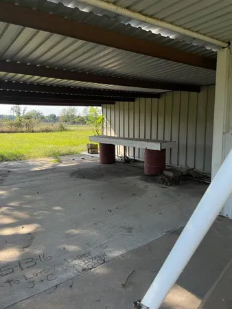 a view of a backyard of the house