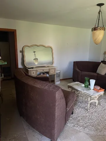 a bedroom with bed and window