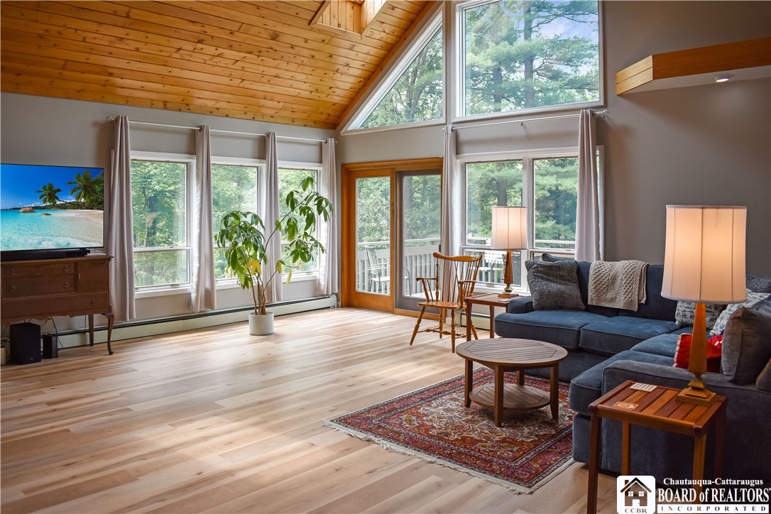 3045 West Oak Hill Road Ellicott, NY 14701 - Photo 8 of 34 Cathedral Wood Ceiling with Lots of glass and skyl