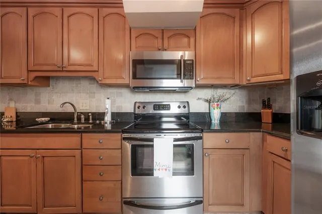 a bedroom with furniture and a large window