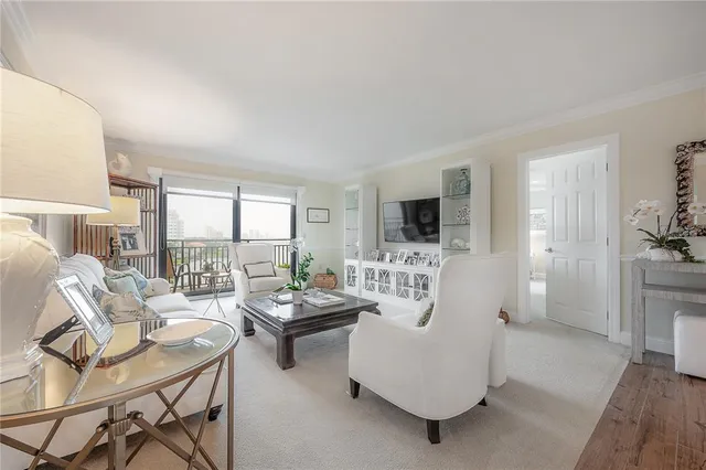 a living room with fireplace furniture and a flat screen tv