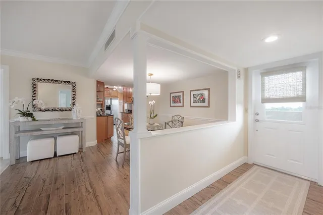 a kitchen with granite countertop a sink stove and refrigerator