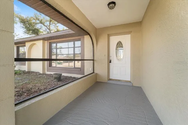 view of room with window and ceiling fan