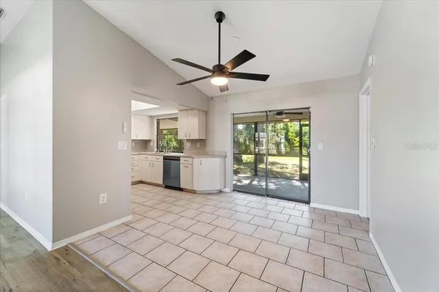 a view of a kitchen with a sink and a window