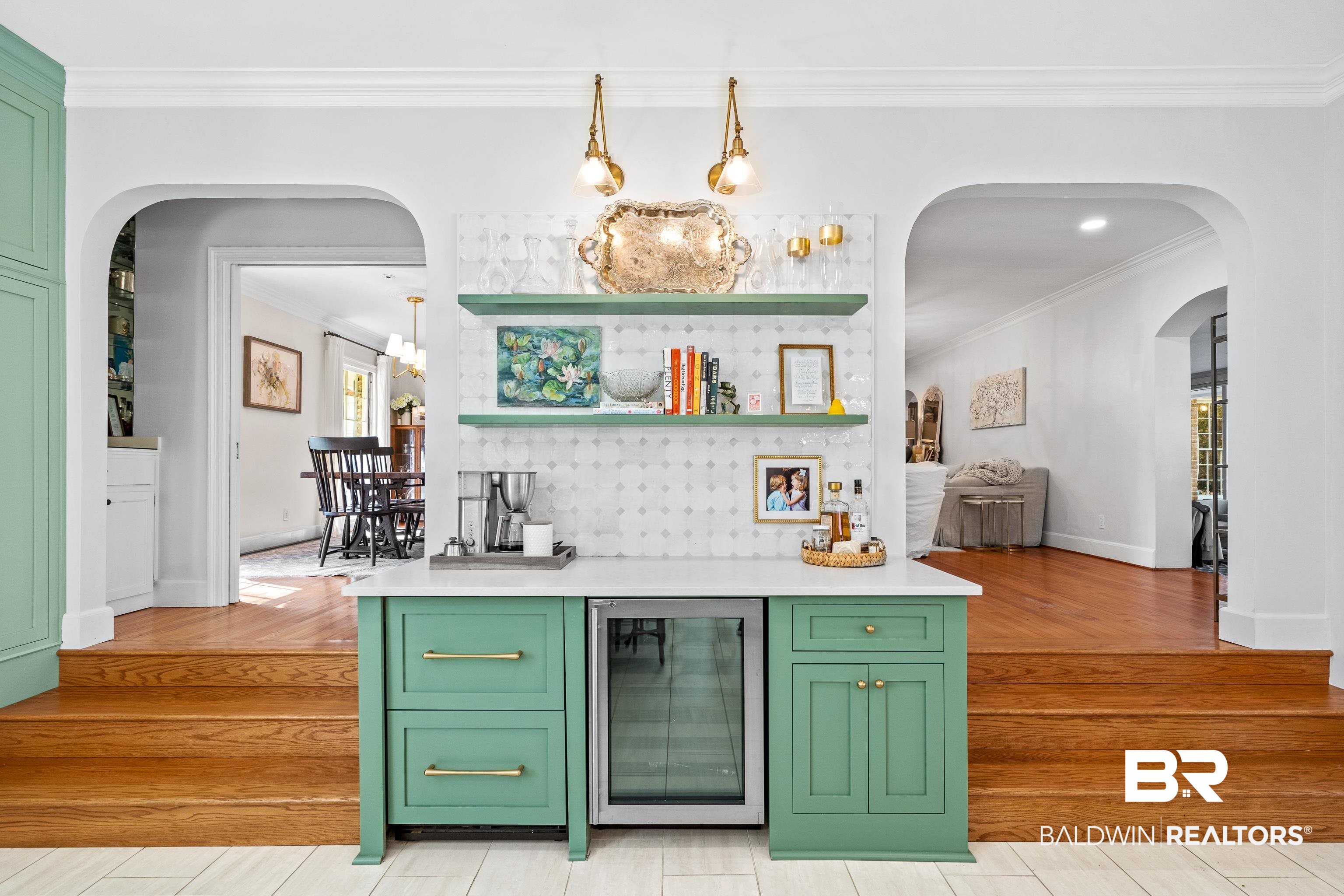 141 Myrtlewood Lane Mobile, AL 36608 - Photo 10 of 44 Kitchen with green cabinets, light countertops, crown molding, wine cooler, and arched walkways