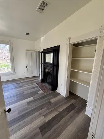 a view of a big yard with an trees