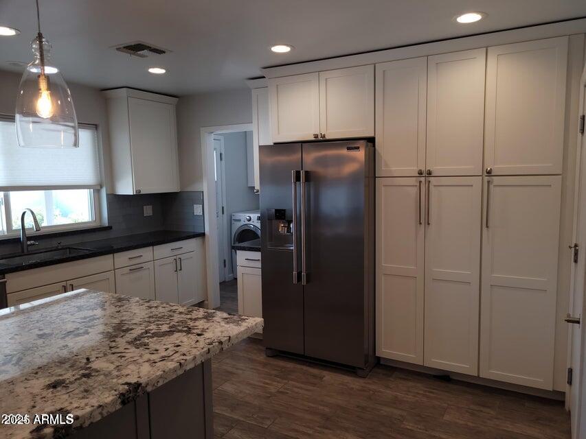 2821 East Cortez Street Phoenix, AZ 85028 - Photo 5 of 18 a kitchen with stainless steel appliances granite countertop a refrigerator and a sink