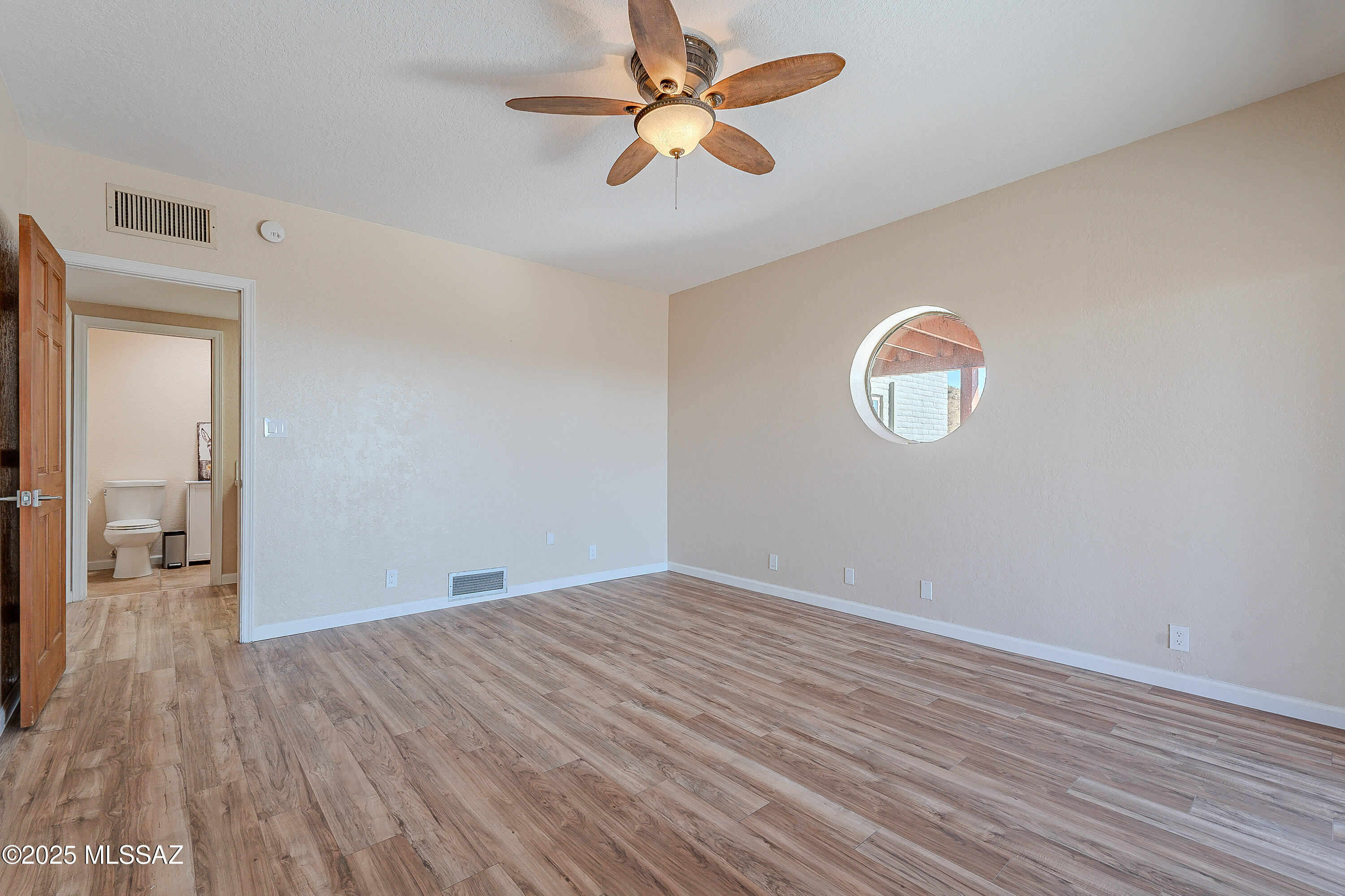 467 Camino Osito Rio Rico, AZ 85648 - Photo 21 of 50 a view of empty room with wooden floor