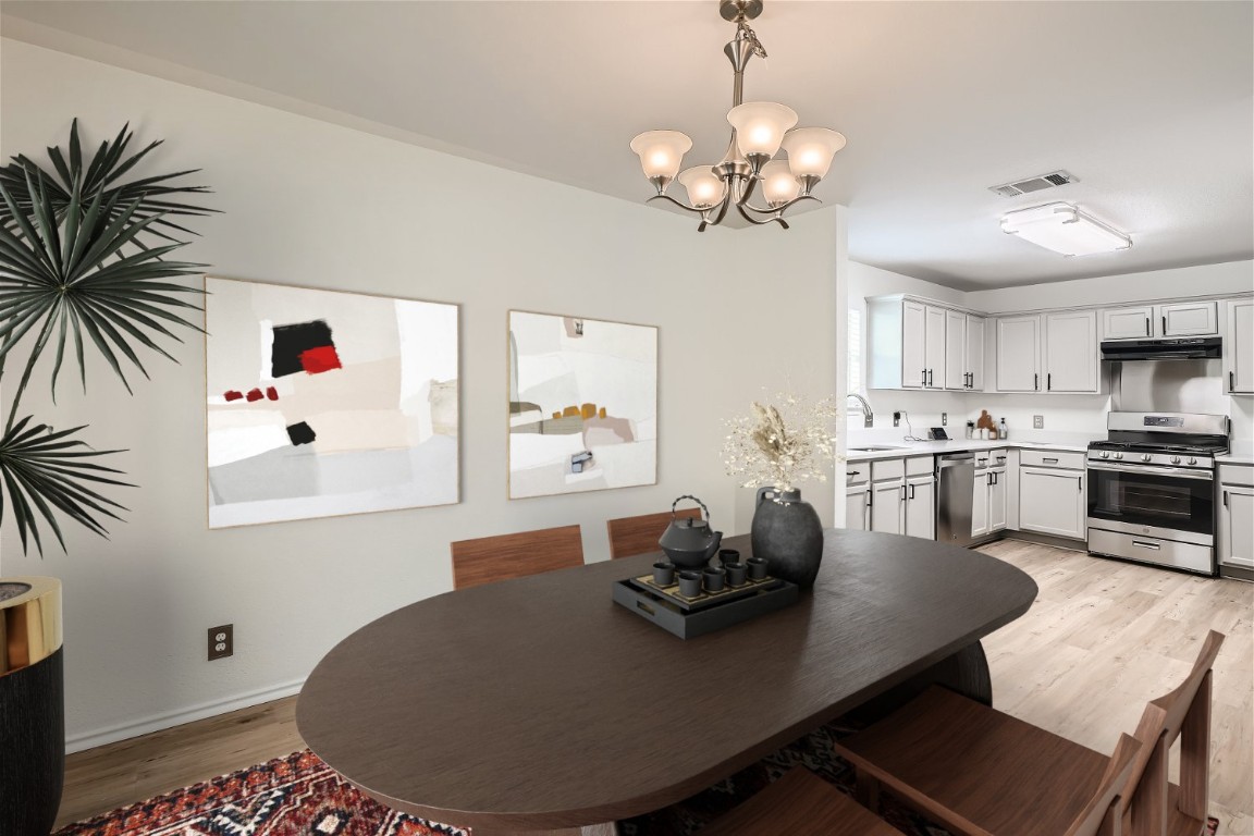 6937 Sabrina Drive Austin, TX 78747 - Photo 1 of 1 a living room with kitchen island furniture and a chandelier