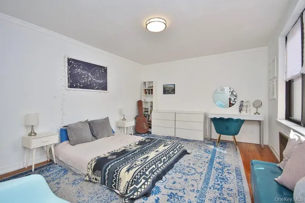 a bedroom with a bed and a table
