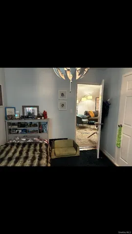 a view of a living room and kitchen