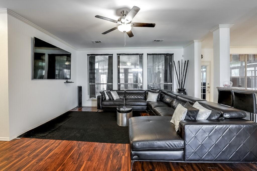 706 Gentry Drive Arlington, TX 76018 - Photo 11 of 39 a living room with furniture and large windows
