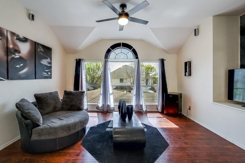 706 Gentry Drive Arlington, TX 76018 - Photo 21 of 39 a living room with furniture and a large window