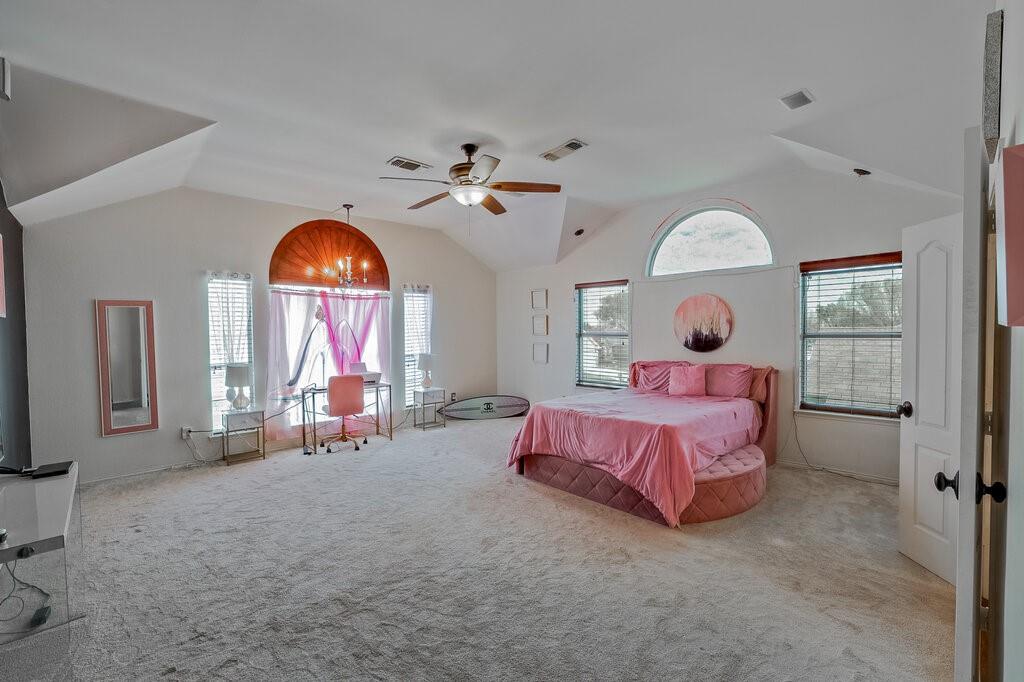 706 Gentry Drive Arlington, TX 76018 - Photo 23 of 39 a bed room with a bed and a chair