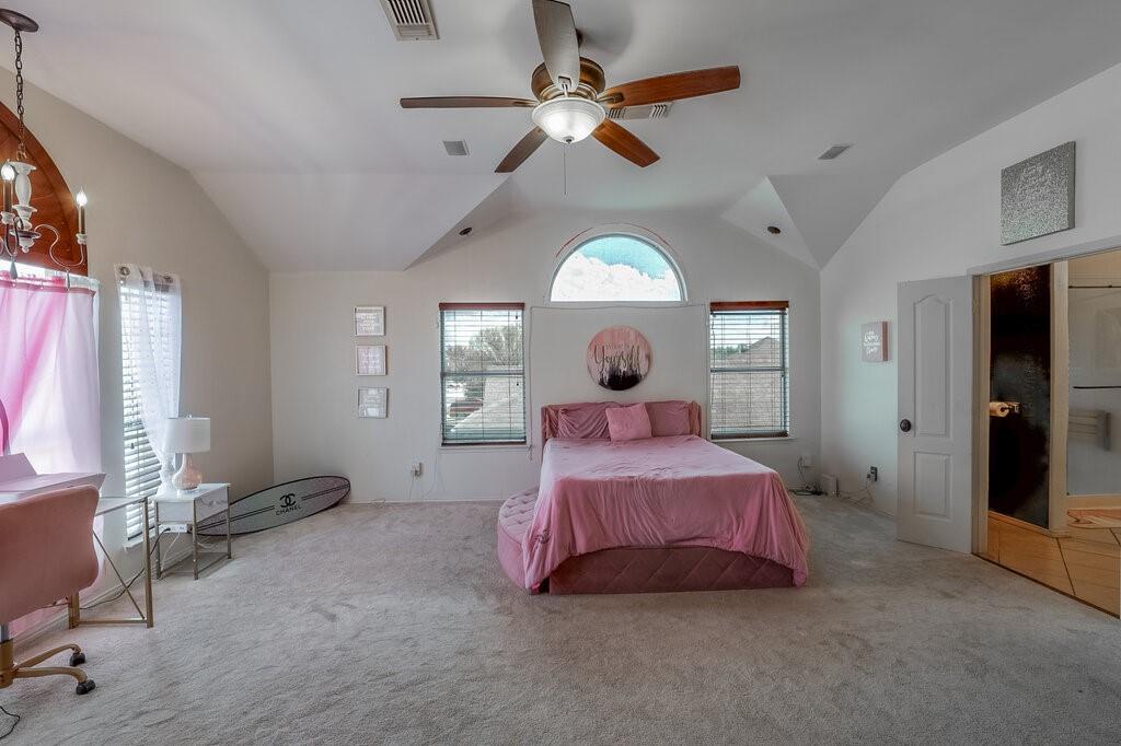 706 Gentry Drive Arlington, TX 76018 - Photo 24 of 39 a bedroom with a bed and window