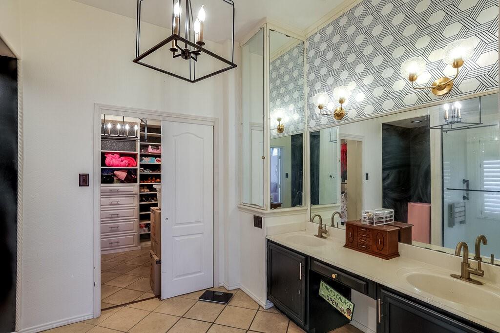 706 Gentry Drive Arlington, TX 76018 - Photo 25 of 39 a bathroom with a sink vanity and a mirror