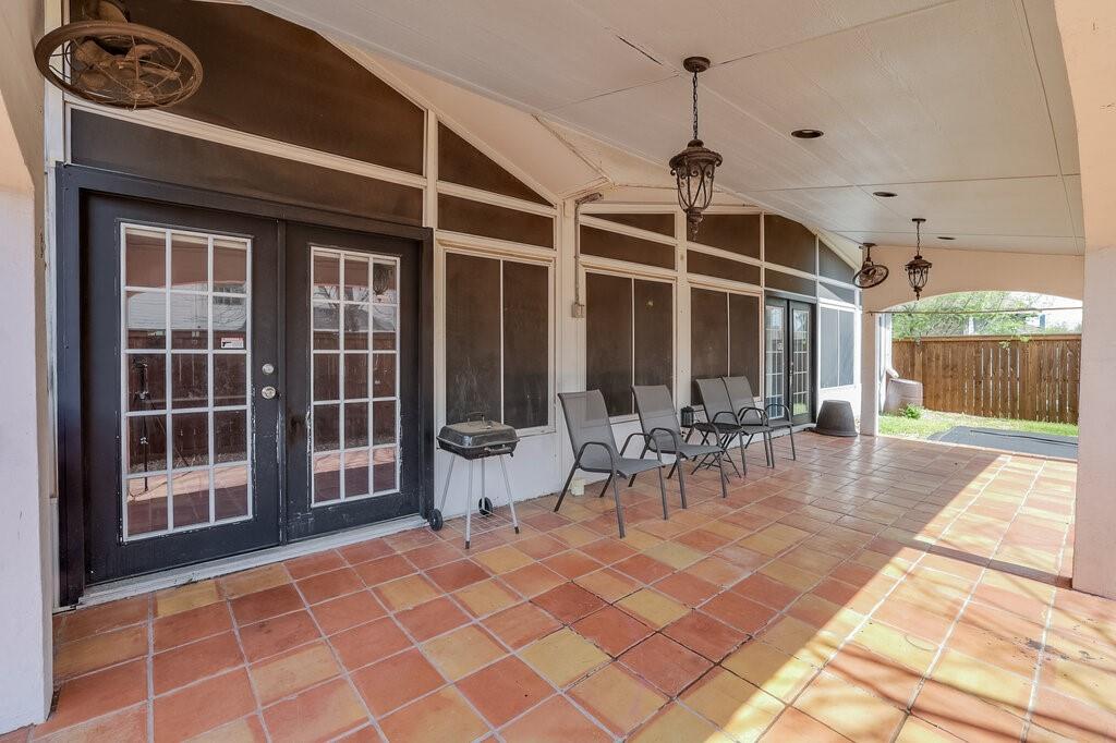 706 Gentry Drive Arlington, TX 76018 - Photo 35 of 39 a view of a dinning table and chairs in the patio