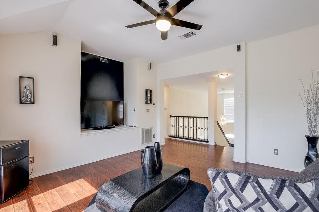 706 Gentry Drive Arlington, TX 76018 - Photo 7 of 39 a living room with furniture and a flat screen tv