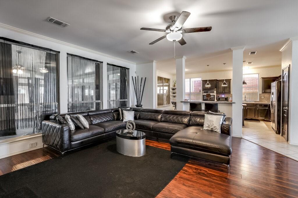 706 Gentry Drive Arlington, TX 76018 - Photo 8 of 39 a living room with furniture ceiling fan and a rug