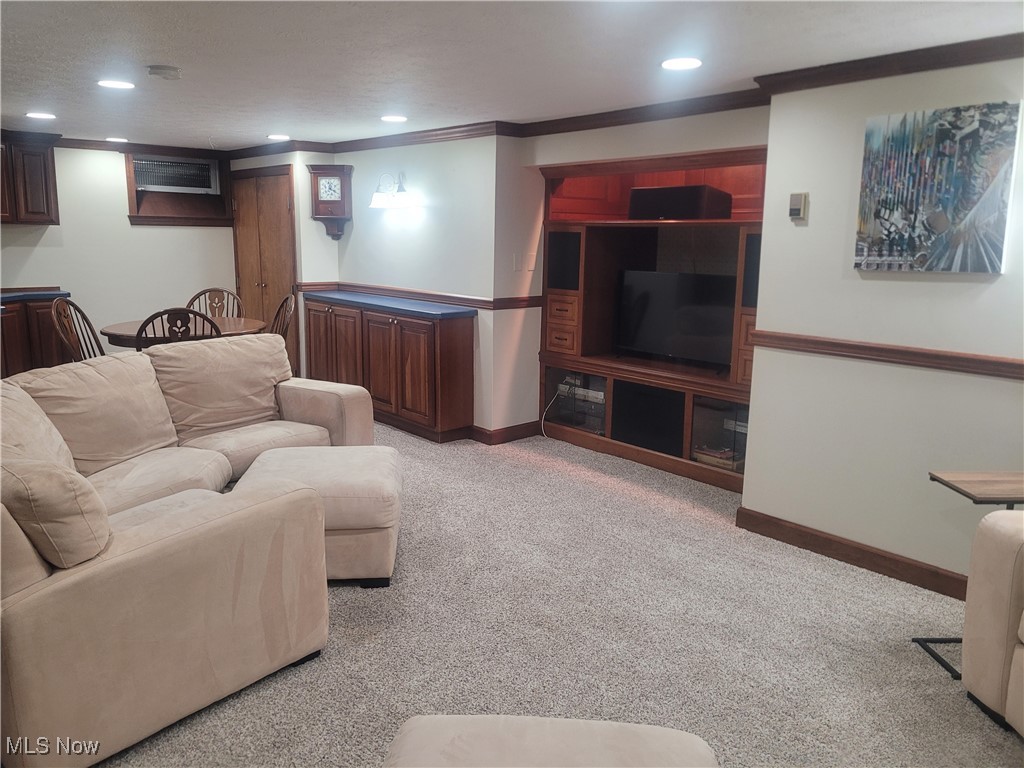1372 Mayfield Ridge Road Cleveland, OH 44124 - Photo 27 of 37 Carpeted living room with recessed lighting and ornamental molding