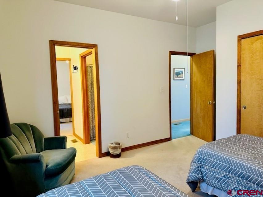 105 Indian Hill Road Mosca, CO 81146 - Photo 13 of 38 2nd bedroom - see entry and Jack and Jill full bathroom amenities.