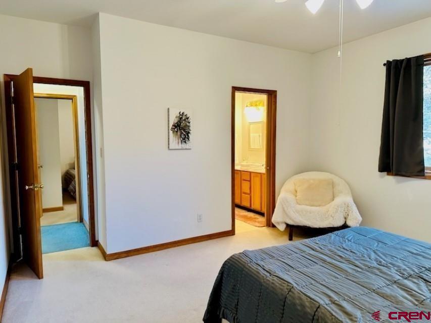 105 Indian Hill Road Mosca, CO 81146 - Photo 15 of 38 3rd bedroom - pictures shows the entry. Includes a queen size bed and Jack and Jill bathroom amenities.