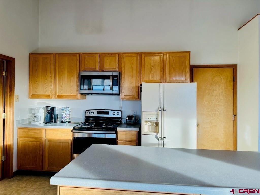 105 Indian Hill Road Mosca, CO 81146 - Photo 23 of 38 Kitchen pantry is located north of the refrigerator. Kitchen features a nice island for prep cook while cooking.