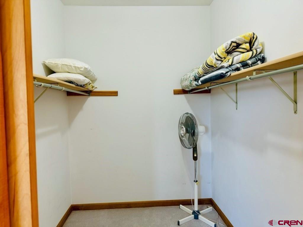 105 Indian Hill Road Mosca, CO 81146 - Photo 33 of 38 Primary bedroom closet.