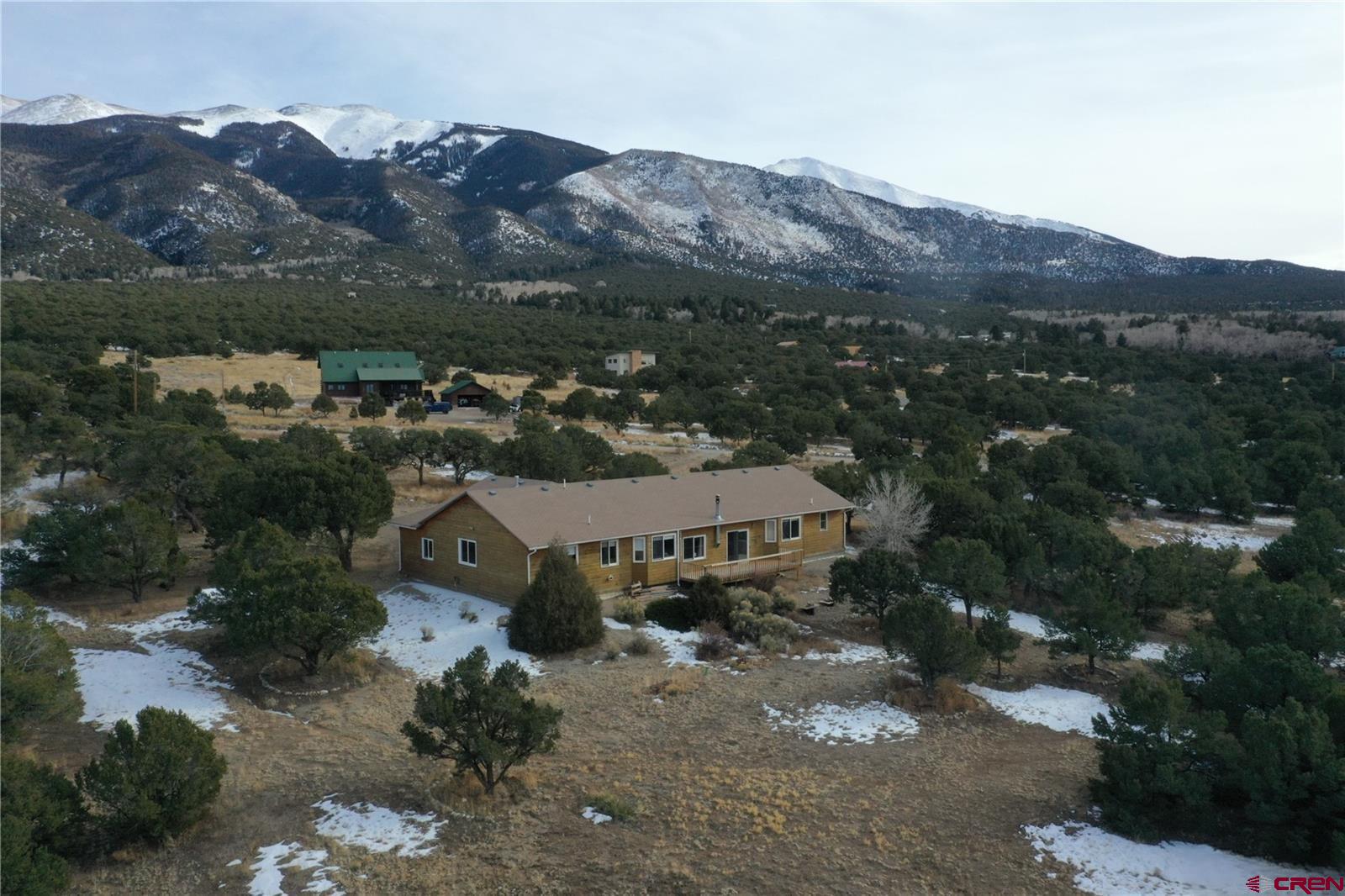 105 Indian Hill Road Mosca, CO 81146 - Photo 4 of 38 Exceptional well-maintained home. West view is Sangre De Cristo Mountain range. Zapata Falls is about 2-miles away.