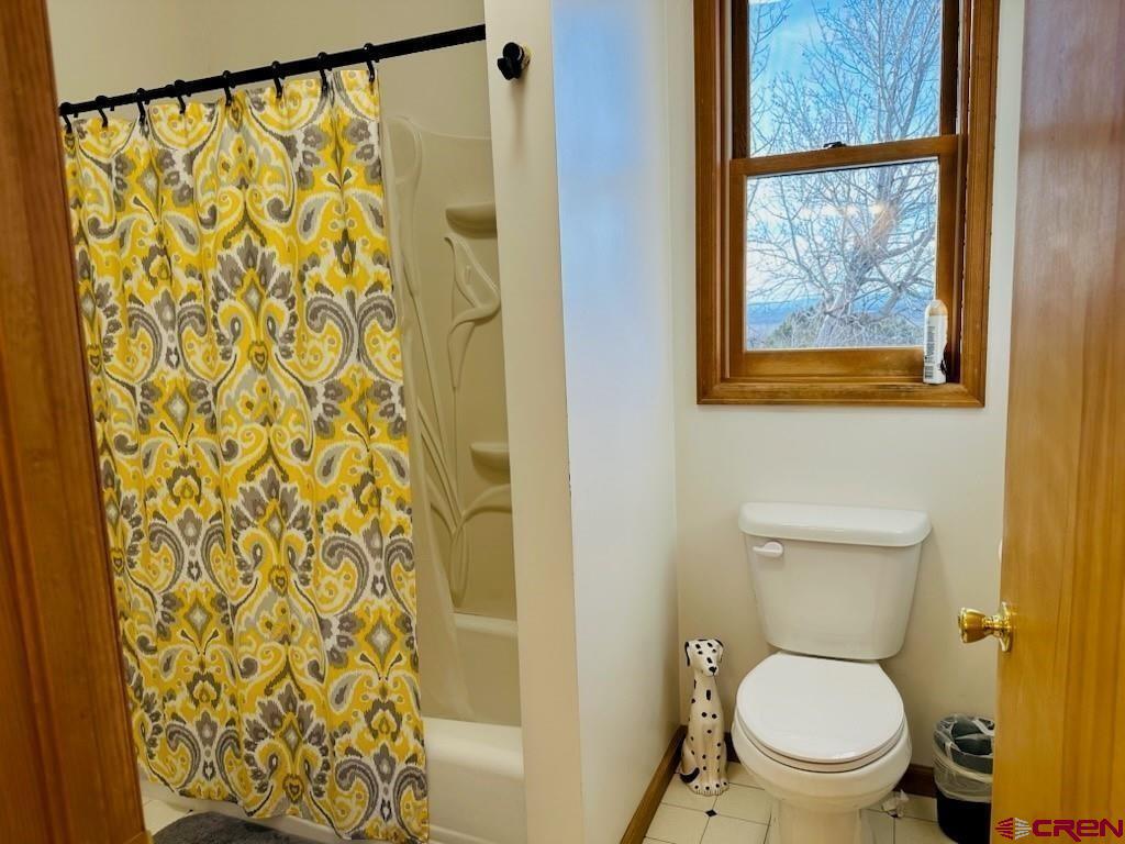 105 Indian Hill Road Mosca, CO 81146 - Photo 9 of 38 Primary bathroom has separate bath/shower and toilet with top of line fixtures in stall area.