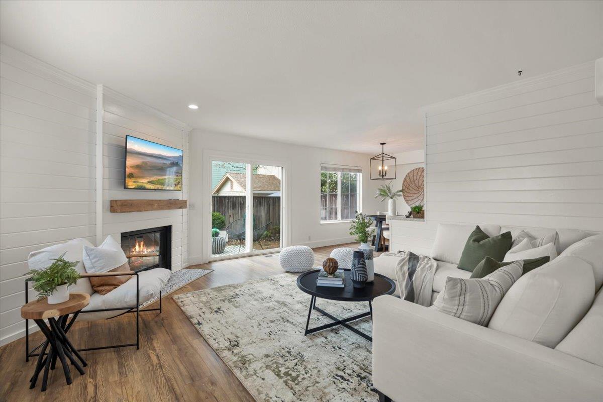 16761 San Luis Way Morgan Hill, CA 95037 - Photo 1 of 35 a living room with furniture a fireplace and a large window