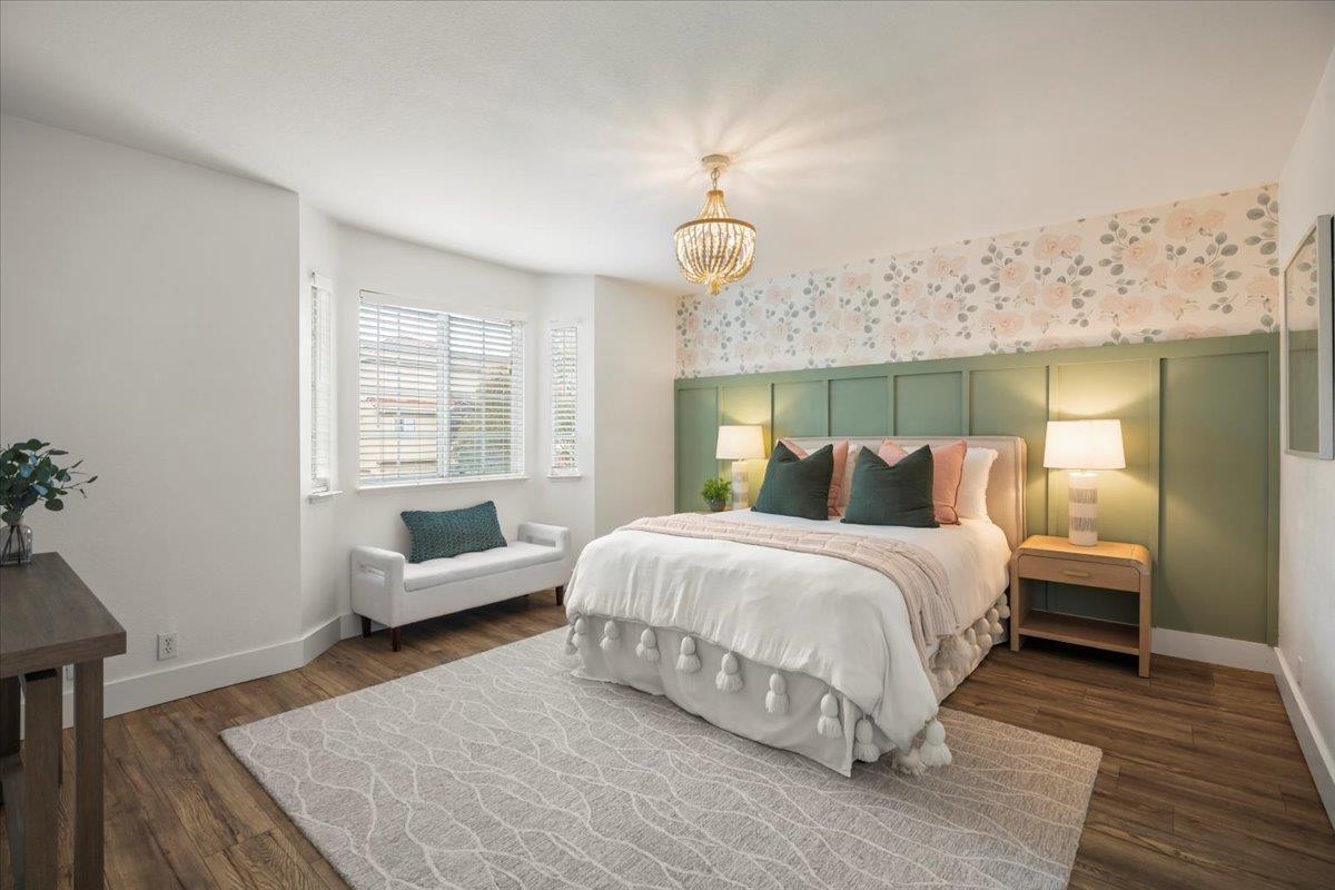 16761 San Luis Way Morgan Hill, CA 95037 - Photo 20 of 35 a spacious bedroom with a bed and a couch