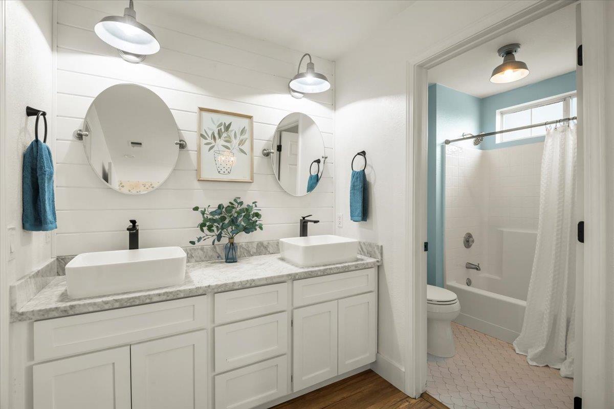 16761 San Luis Way Morgan Hill, CA 95037 - Photo 22 of 35 a bathroom with a double vanity sink mirror and toilet