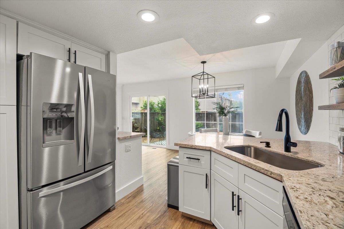 16761 San Luis Way Morgan Hill, CA 95037 - Photo 10 of 35 a kitchen with stainless steel appliances granite countertop a refrigerator and a sink