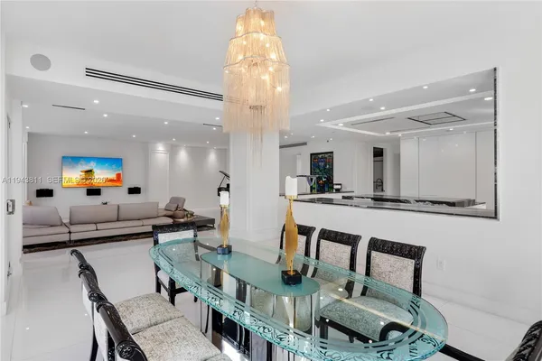 a kitchen with stainless steel appliances kitchen island granite countertop a sink and a stove top oven