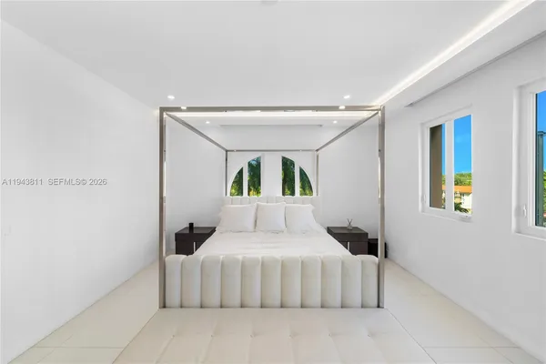 a bathroom with a bathtub and double vanity