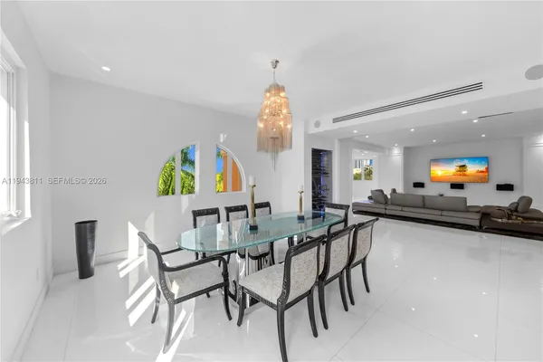 a view of a dining room with furniture and a window