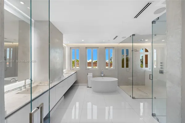 a bathroom with a double vanity sink and mirror