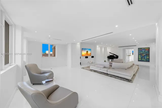 a kitchen with stainless steel appliances kitchen island granite countertop a sink and a stove top oven